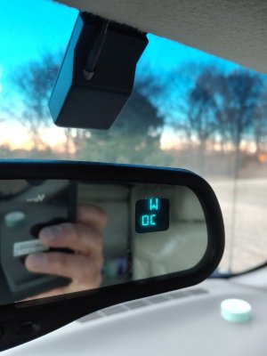 Where is the ambient temperature sensor on a 2006 gmc sierra. The temp  readout on the rearview says OC. I have looked on